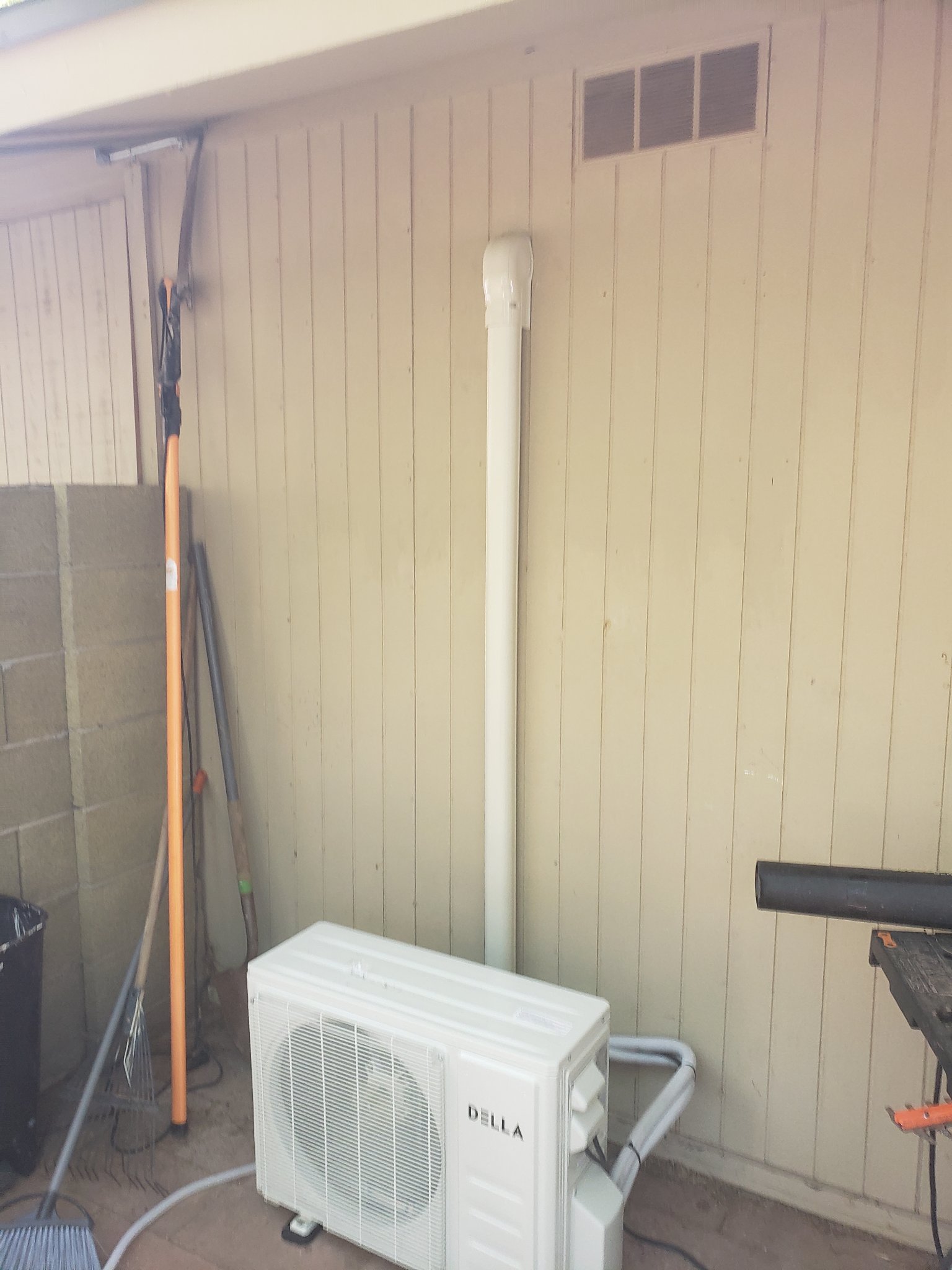 After reinstall — clean line set cover, unit on black pad, professional finish